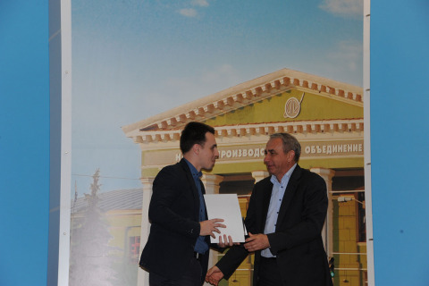 The diploma of the first degree present to the projects manager of the scientific-engineering center A. M. Yablokov at scientific-technical conference of young specialists of NPO"Iskra", dedicated to 110 anniversary of the first designer Mikhail Tsirulnikov birth. From left to right: project manager of the center A. M. Yablokov, General Director of PAO NPO "Iskra" V. B. Shatrov